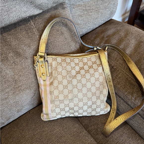 Gucci Handbags - Gucci GG Canvas Metallic Gold Crossbody Bag